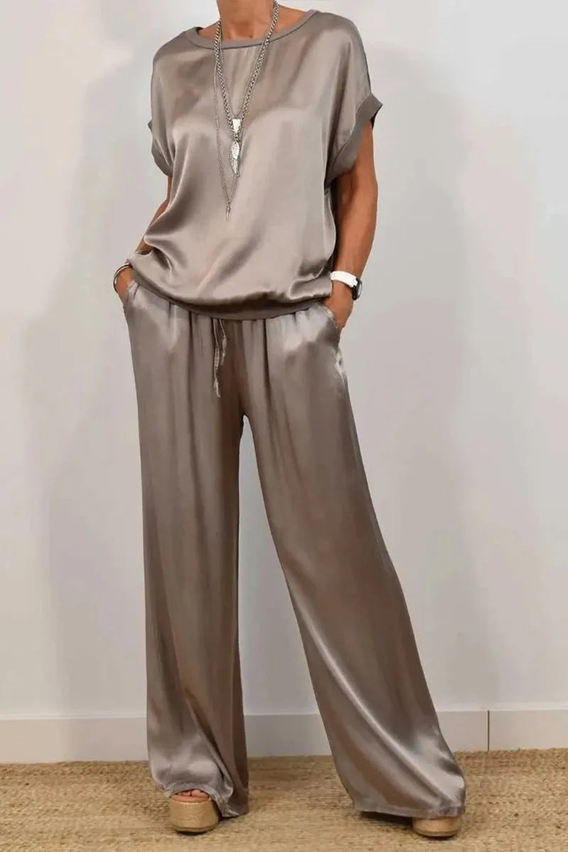 Women's two-piece satin set, loose-fitting T-shirt and wide-leg pants.