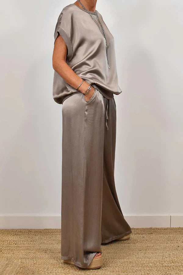 Women's two-piece satin set, loose-fitting T-shirt and wide-leg pants.